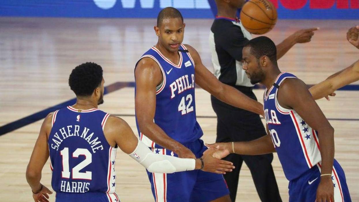 Al Horford #42 of the Philadelphia 76ers celebrates with Tobias Harris #12 and Alec Burks #20