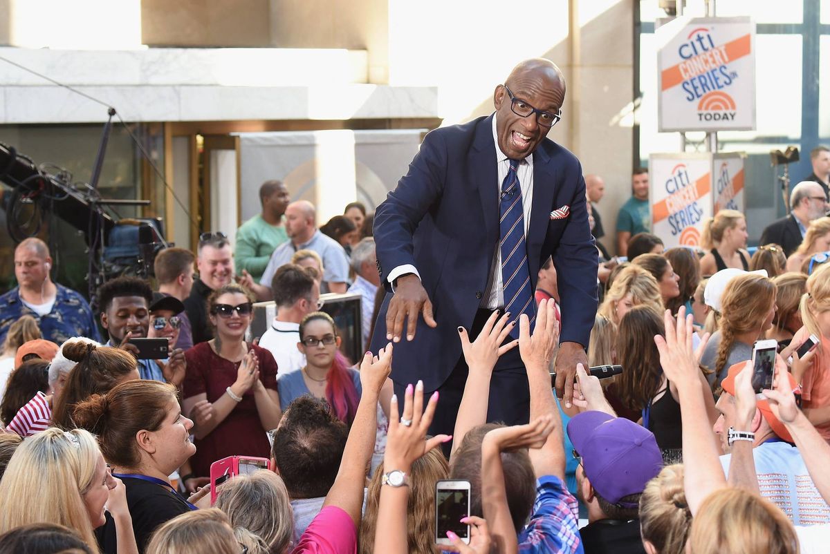 Al Roker shakes hands with fans