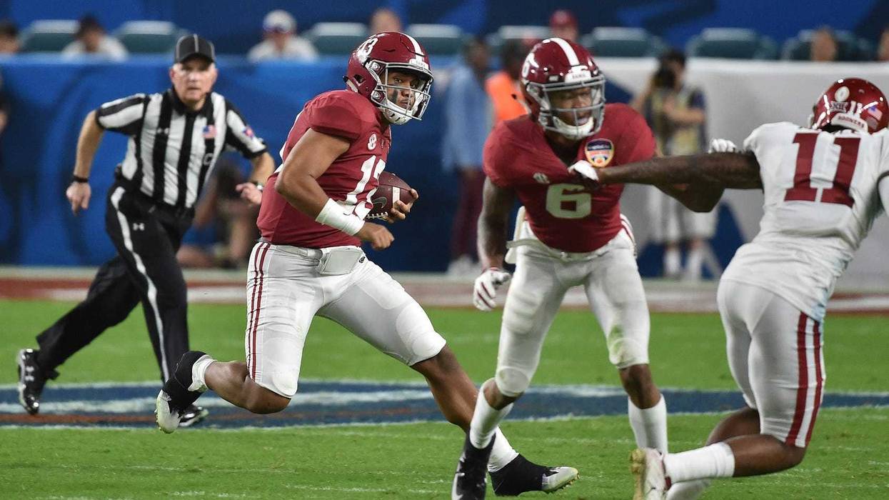 Alabama Crimson Tide quarterback Tua Tagovailoa (13) runs with the ball against the Oklahoma Sooners during the second half of the 2018 Orange Bowl college football playoff semifinal game at Hard Rock Stadium.