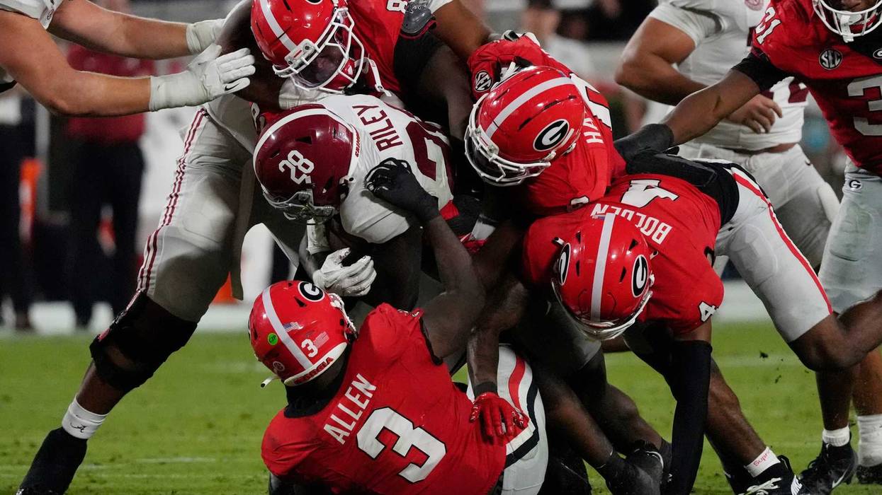 Alabama Crimson Tide running back Kevin Riley (28) is stopped by the Georgia Bulldogs defense during the second half of a NCAA college football game against Alabama in Athens, Ga., on Saturday, September 27, 2025.