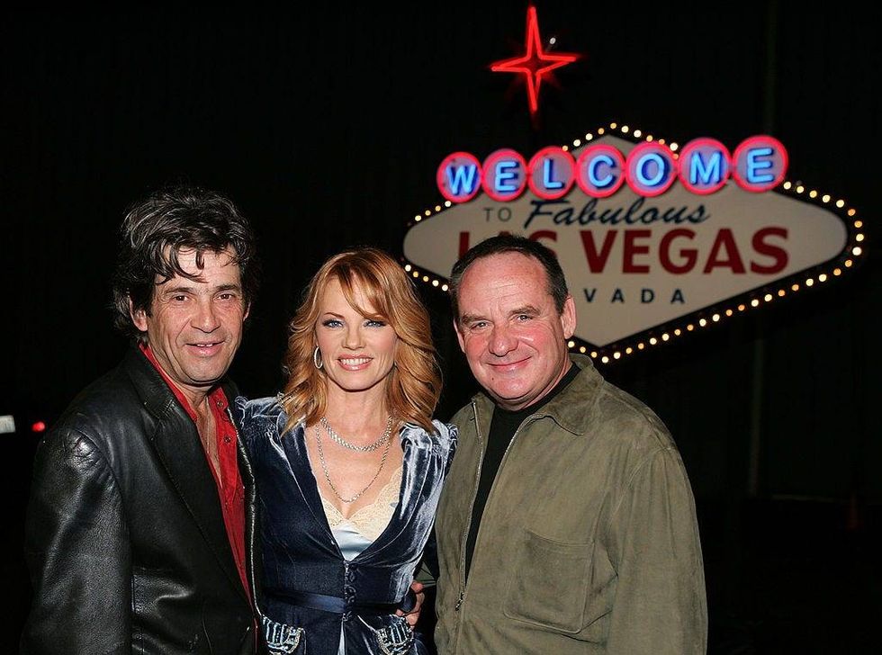 Alan Rosenberg, (L) Marg Helgenberger, (C) and Paul Guilfoyle (R) arrive for the party for the CSI 100th episode party in Hanger 8 at the Santa Monica Airport November 13, 2004 in Santa Monica, California.