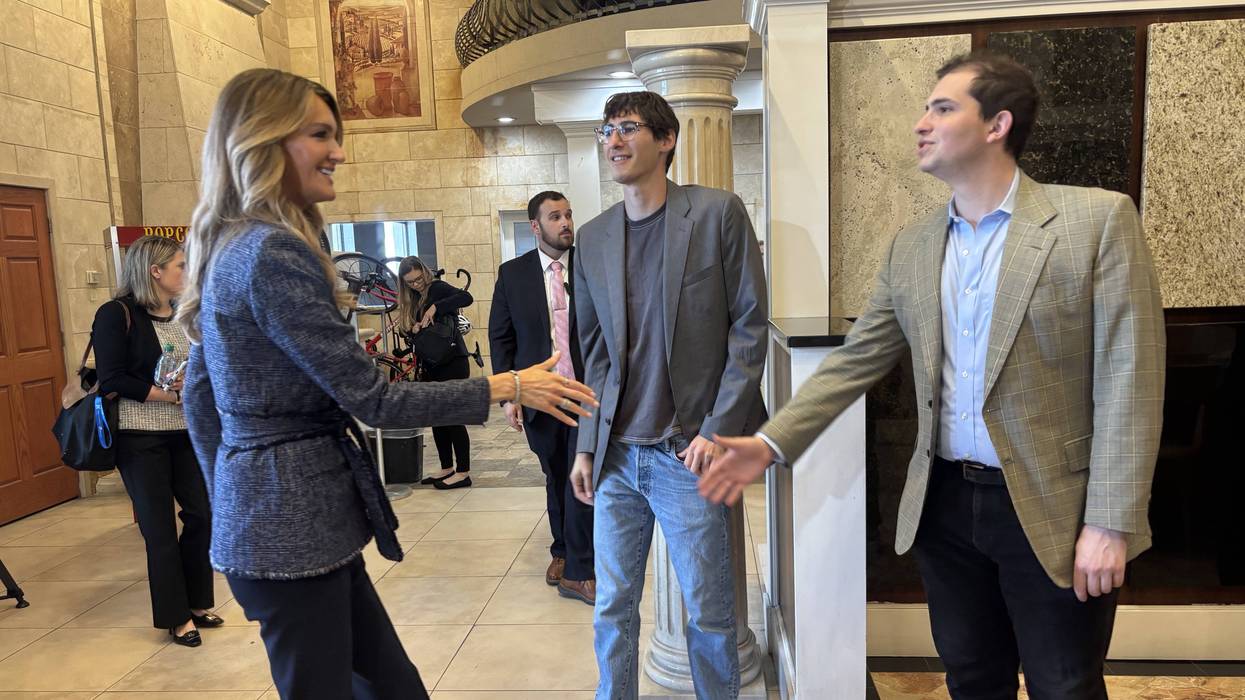 Albacore co-founders John Huddleston Ccenter) and Dante Visbort (right) greet Small Business Administration head Kelly Loeffler at their South Philly headquarters on Tuesday, Aug. 25.