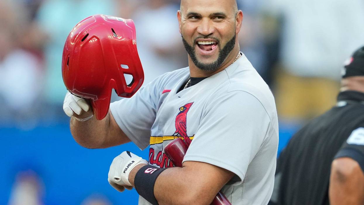 Albert Pujols #5 of the St. Louis Cardinals tips his helmet to the crowd in a break against the Toronto Blue Jays in the first inning during their MLB game at the Rogers Centre on July 26, 2022 in Toronto, Ontario, Canada.