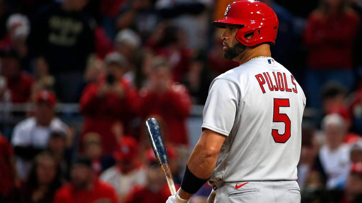 albert pujols holding a bat