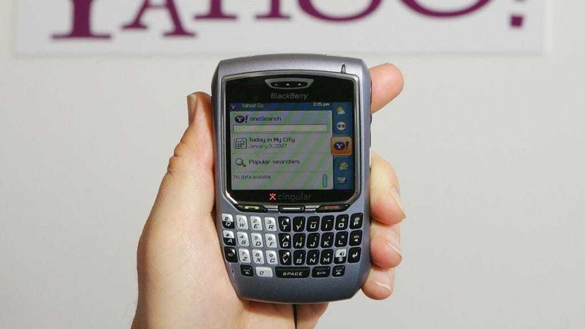 Alex Laity of Yahoo Inc. holds a Blackberry 8700 displaying Yahoo's OneSearch mobile search home page which is part of the company's newly-launched Go For Mobile 2.0 mobile internet service at the Las Vegas Convention Center during the 2007 International Consumer Electronics Show January 9, 2007 in Las Vegas, Nevada.
