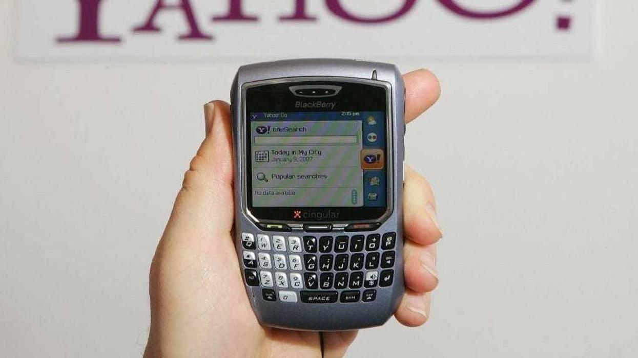Alex Laity of Yahoo Inc. holds a Blackberry 8700 displaying Yahoo's OneSearch mobile search home page which is part of the company's newly-launched Go For Mobile 2.0 mobile internet service at the Las Vegas Convention Center during the 2007 International Consumer Electronics Show January 9, 2007 in Las Vegas, Nevada.