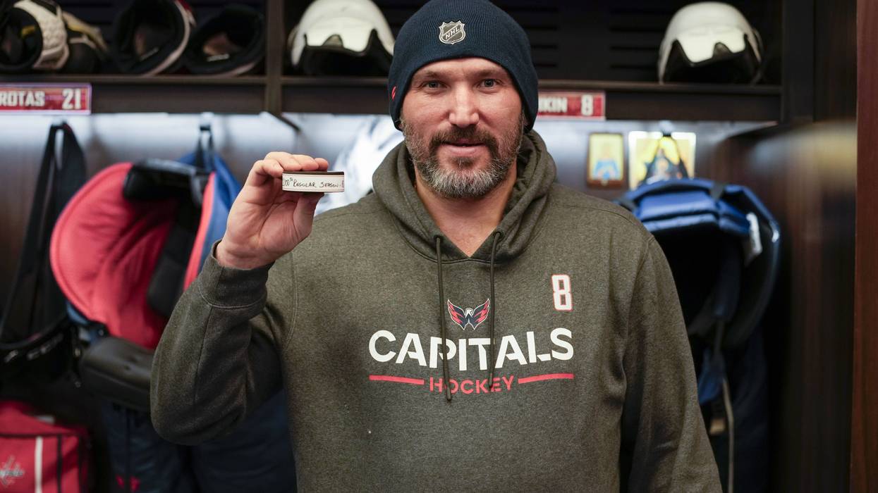 Alex Ovechkin with the puck used to score his 1000th goal