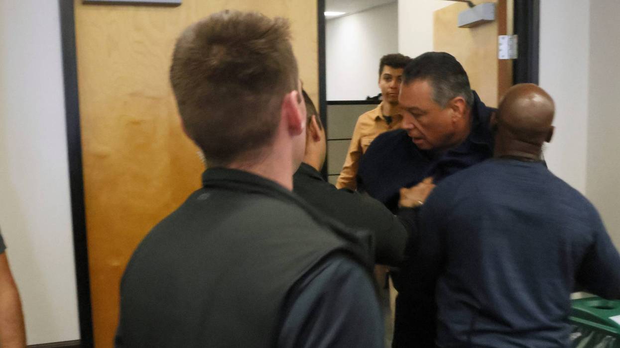 alex padilla being pushed out of room