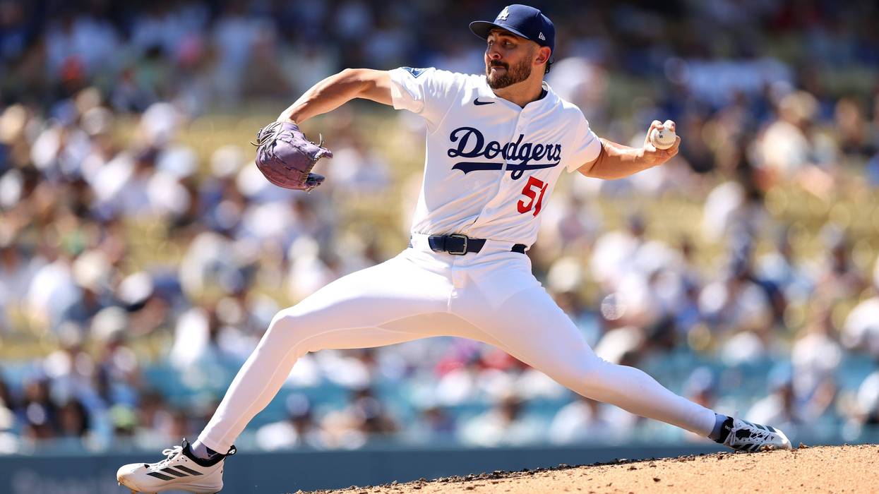 Alex Vesia #51 of the Los Angeles Dodgers pitches against the St. Louis Cardinals during the eighth inning at Dodger Stadium on August 06, 2025 in Los Angeles, California.