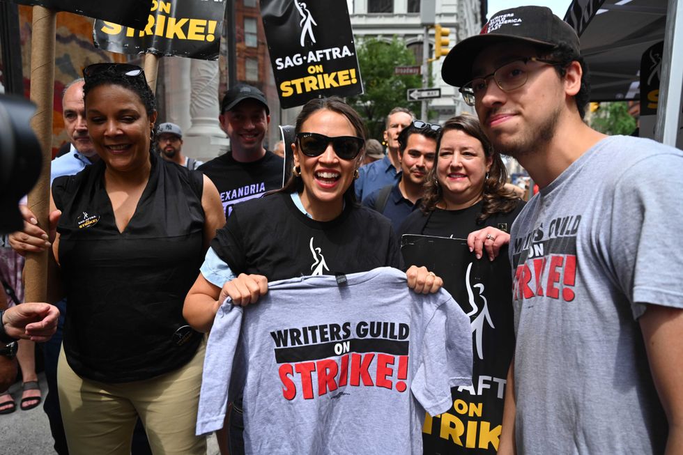 Alexandria Ocasio-Cortez walks the picket line in support of the SAG-AFTRA and WGA strike on July 24, 2023 in New York City.