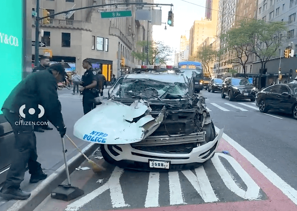 All four officers in the police cruiser suffered minor injuries