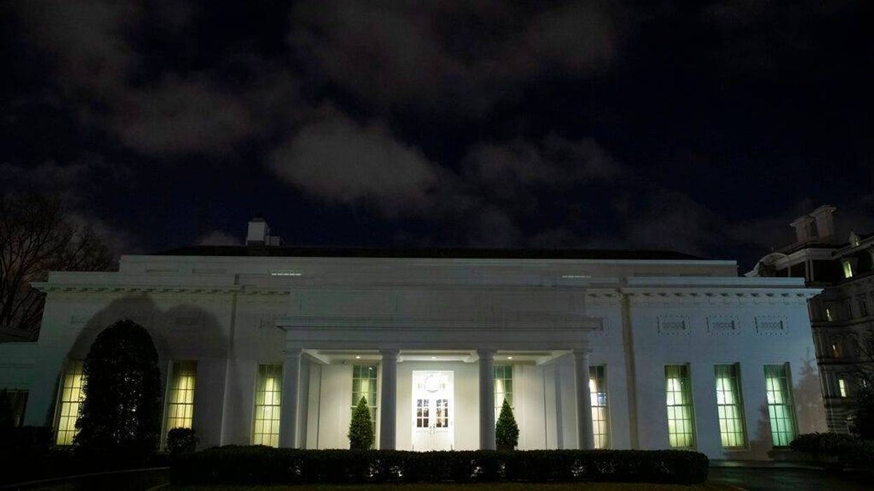 All the lights are on in the windows of the West Wing of the White House after news of a missile attack on an Iraqi air base housing U.S. troops, Tuesday, Jan. 7, 2020, in Washington.