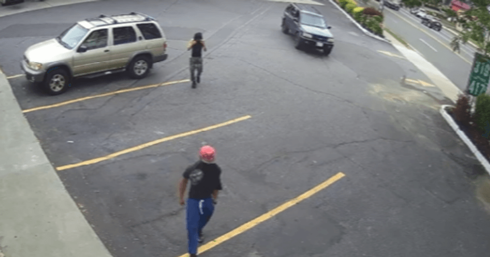 All three defendants allegedly heading towards the victim, with Hernandez in the blue Isuzu.