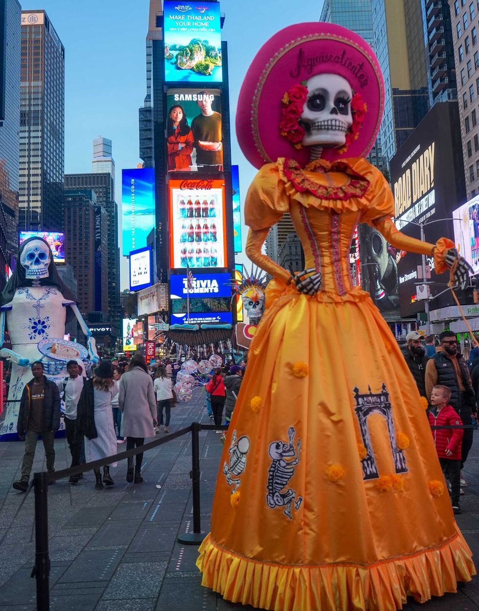 All three sculptures are seen in Times Square on Monday