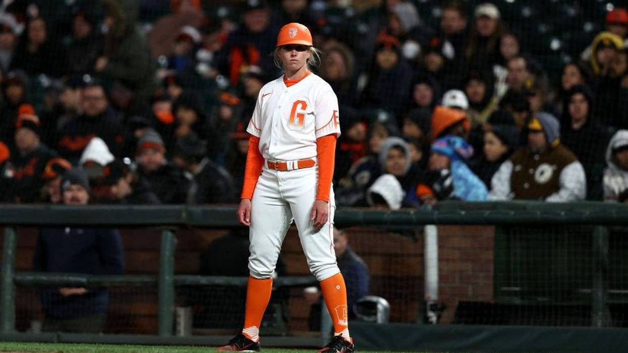 Alyssa Nakken coaches first base for the San Francisco Giants during their game against the San Diego Padres at Oracle Park on April 12, 2022 in San Francisco, California.