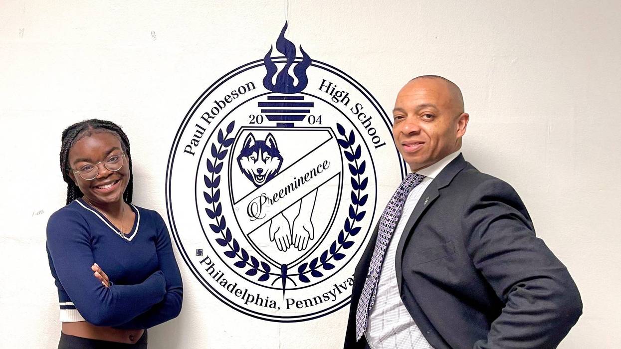 Alyssa Perren (standing with principal and mentor Richard Gordon) is the first student from Paul Robeson High School to be accepted to Harvard University.