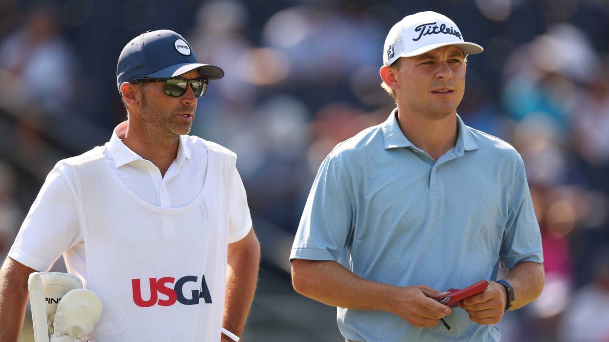 Amateur Gunnar Broin of the United States and his caddie, Chris Baisch, look on from the 13th tee during the second round of the 124th U.S. Open at Pinehurst Resort on June 14, 2024 in Pinehurst, North Carolina.