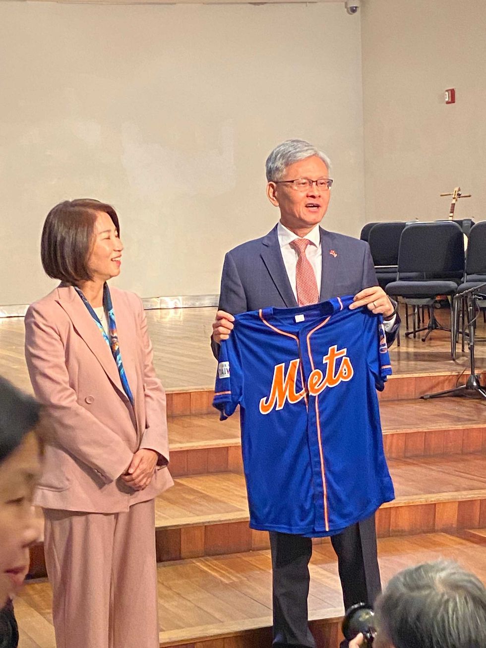 Ambassador James K.J. Lee of the Taipei Economic and Cultural Office in New York presents the magistrate of Pingtung County, Chou Chun-mi, with a New York Mets jersey at the "Tunes from the Islands: An AAPI Celebration Event," on April 30, 2024.