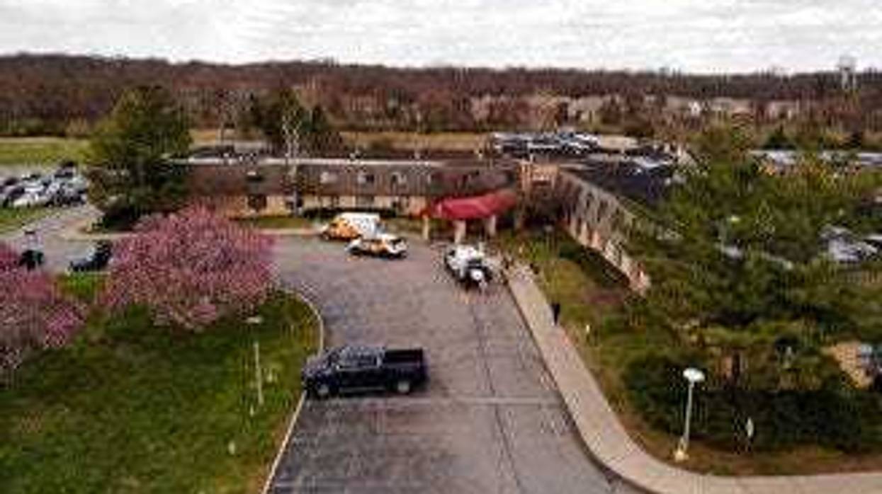 Ambulance crews are parked outside Andover Subacute and Rehabilitation Center in Andover, N.J., on Thursday April 16, 2020. (AP Photo/Ted Shaffrey)