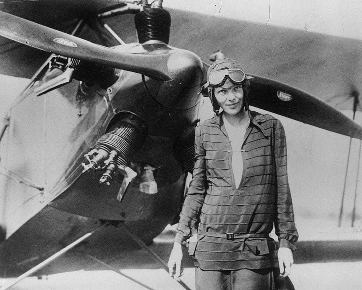 Amelia Earhart stands June 14, 1928 in front of her bi-plane called "Friendship" in Newfoundland.