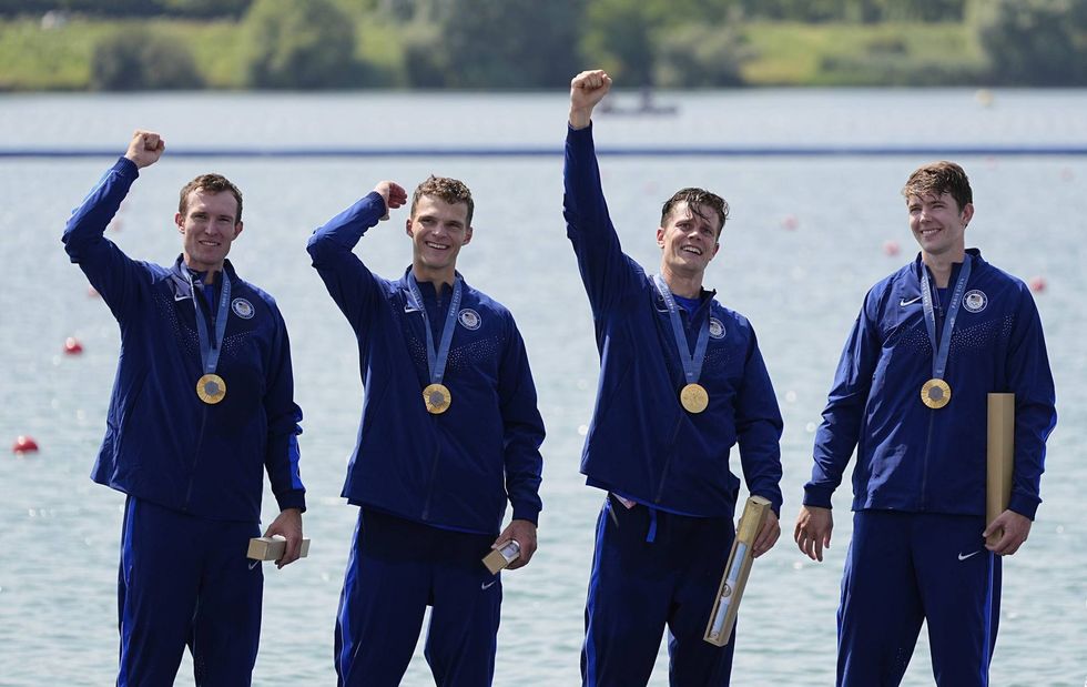 American crew team Nick Mead, Justin Best, Michael Grady and Liam Corrigan celebrate their gold medal win in the men