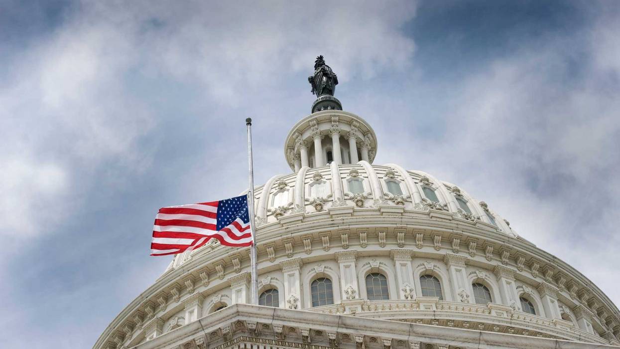 American flag flying at U.S. Capitol.