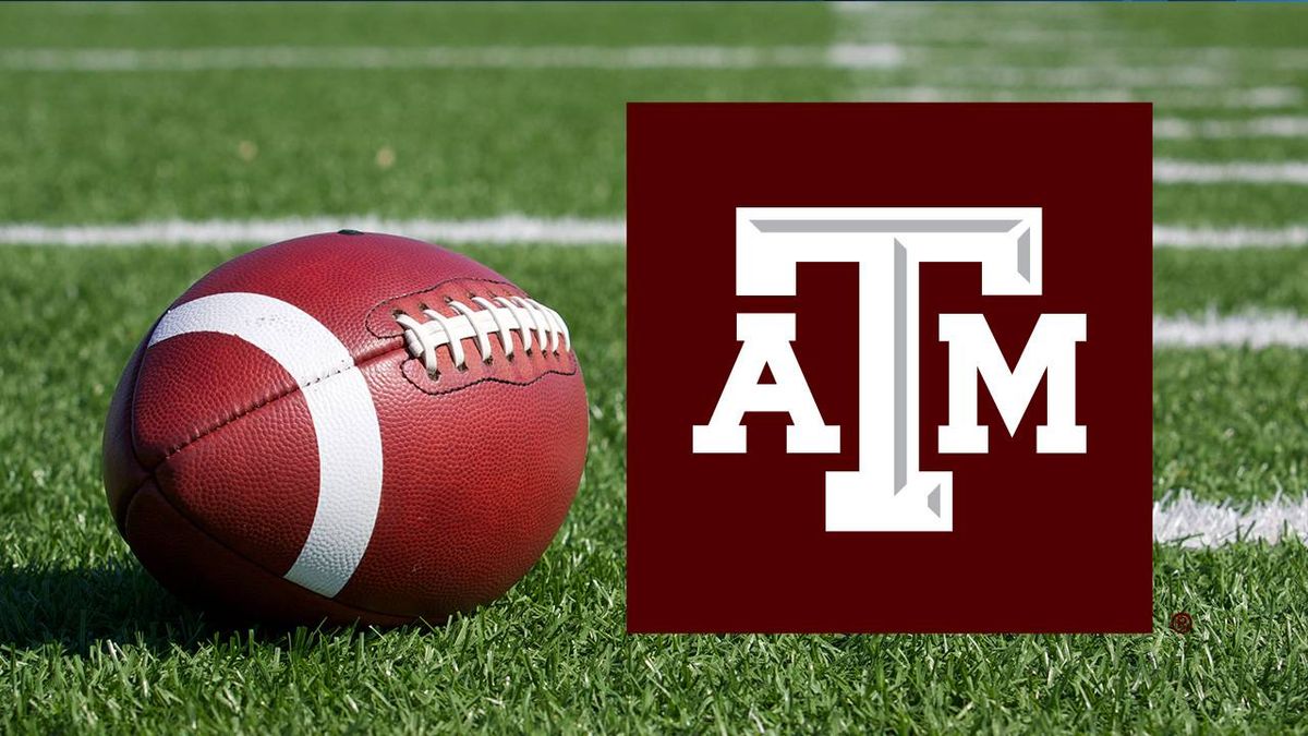 American football on a green field with the Texas A&M (ATM) logo.