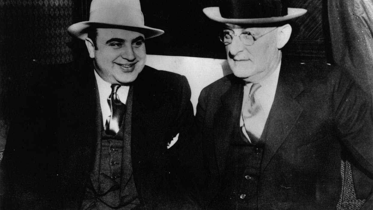 American gangster Al Capone (1899 - 1947) with US Marshall Laubenheimar.