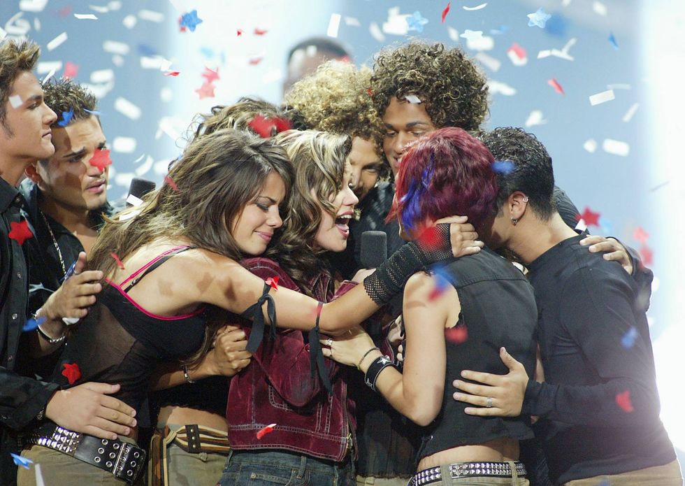 American Idol winner Kelly Clarkson embraces Idol contestants at the Kodak Theatre in Hollywood, Ca., Sept. 4, 2002.