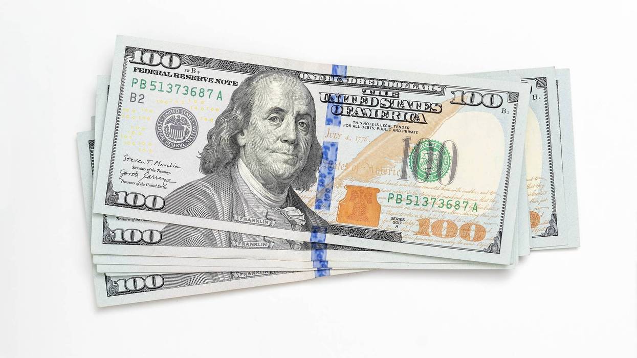 American paper money, currency, cash dollars on white. Close-up. Finance, payment, trade, financial transactions concepts