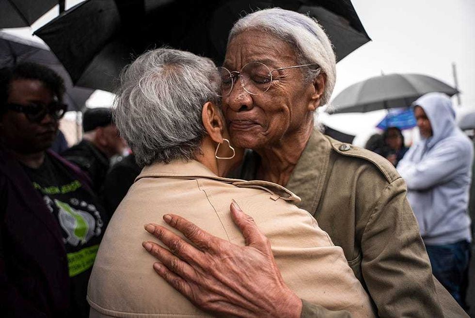 Amina Baraka, mother of Newark Mayor Ras J. Baraka, hugs Rep. Bonnie Watson Coleman, D-N.J., outside of an ICE office after her son