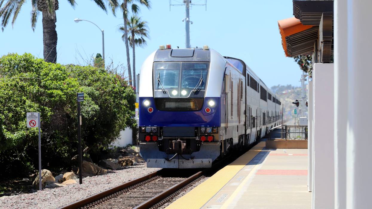 Amtrak Pacific Surfliner Train passing San Clemente Train Station.