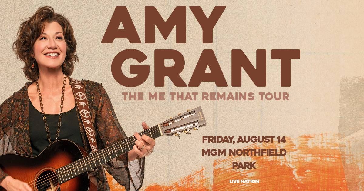 Amy Grant smiling, playing guitar for "The Me That Remains Tour" on Aug 14 at MGM Northfield.