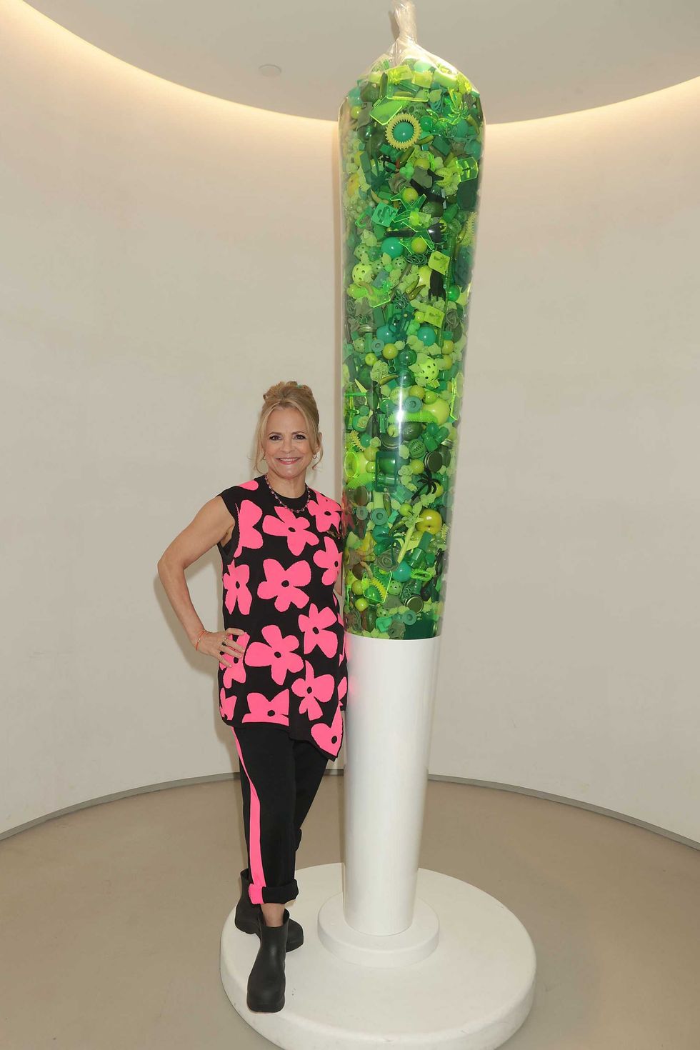 Amy Sedaris stands next to an oversized replica of a cannabis joint at Union Square Travel Agency on Sept. 27, 2023.