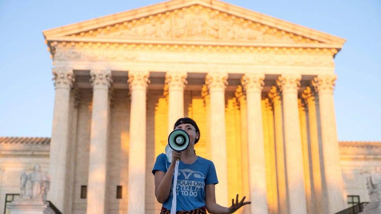 An activist, who declined to provide her name, speaks outside the Supreme Court in protest against the new Texas abortion law that prohibits the procedure around six weeks into a pregnancy on September 2, 2021 in Washington, DC.