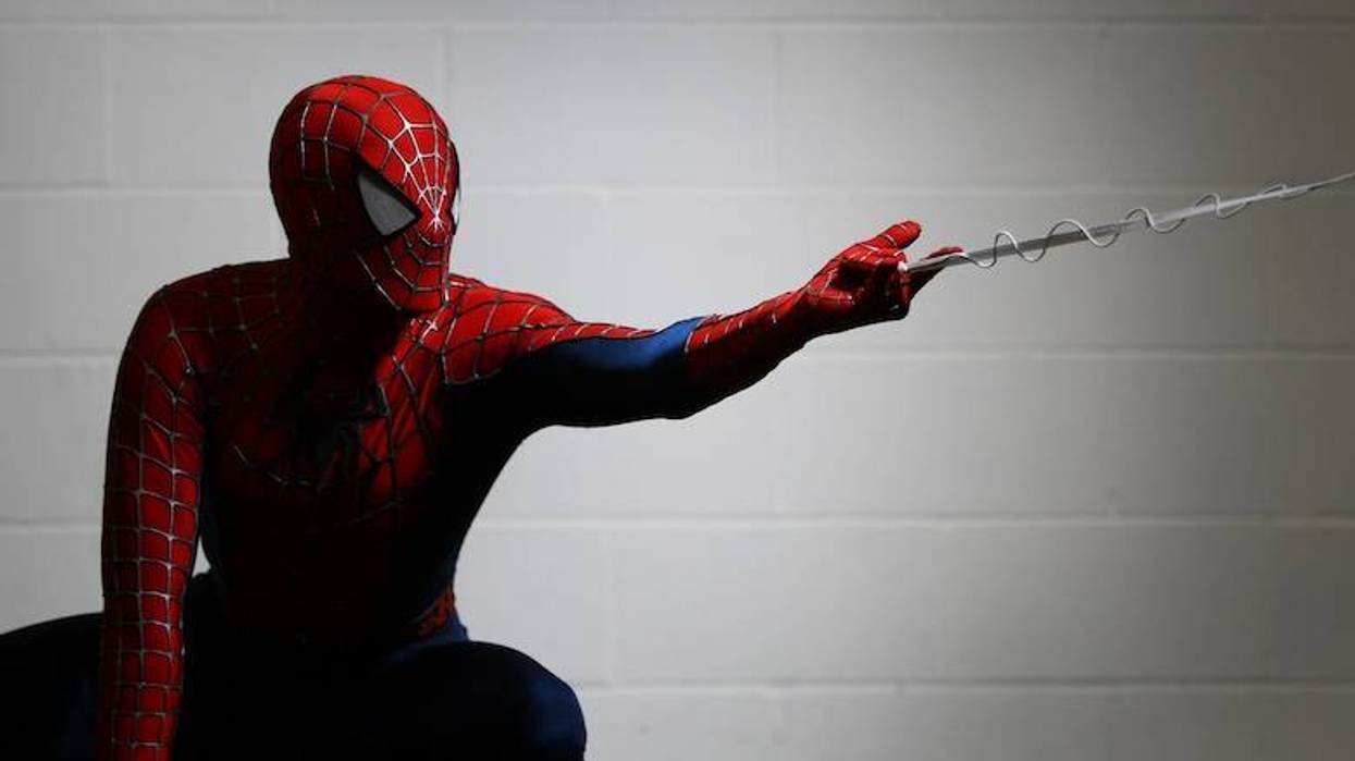 An actor dressed as Spiderman poses for a photo at the London Super Comic Convention at the ExCeL Centre on February 23, 2013 in London, England