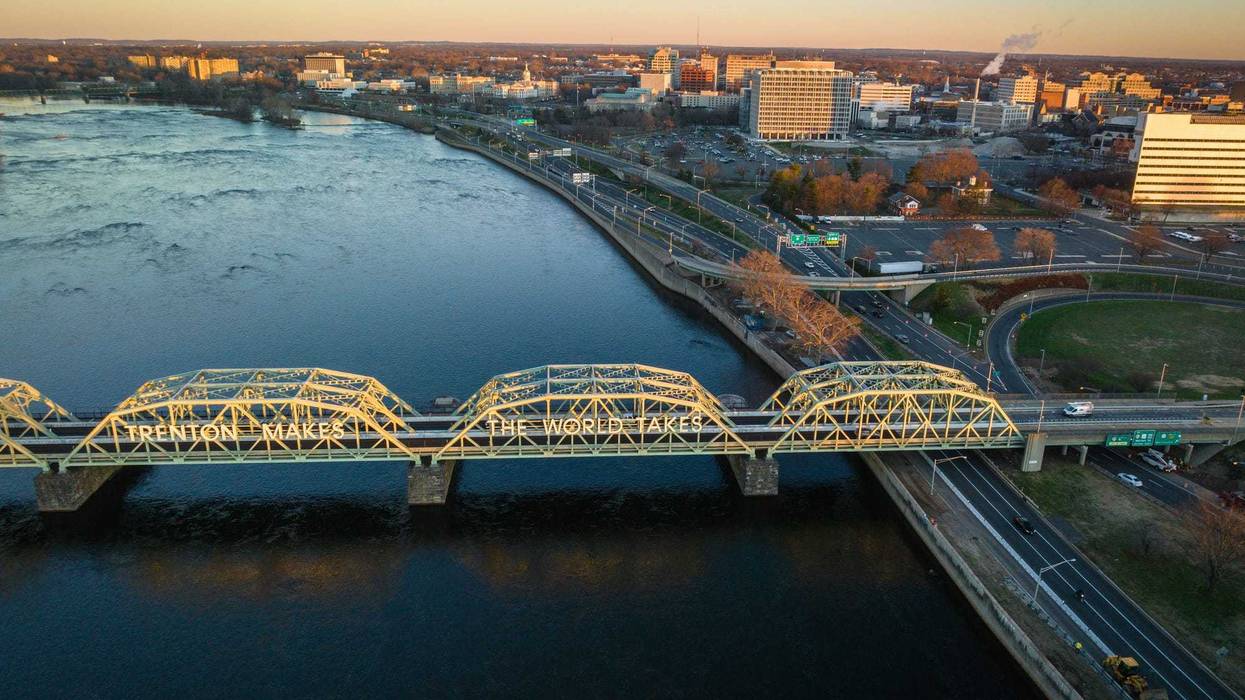 An aerial of the Lower Trenton highway bridge over the Delaware river in Trenton, New Jersey at sunrise.