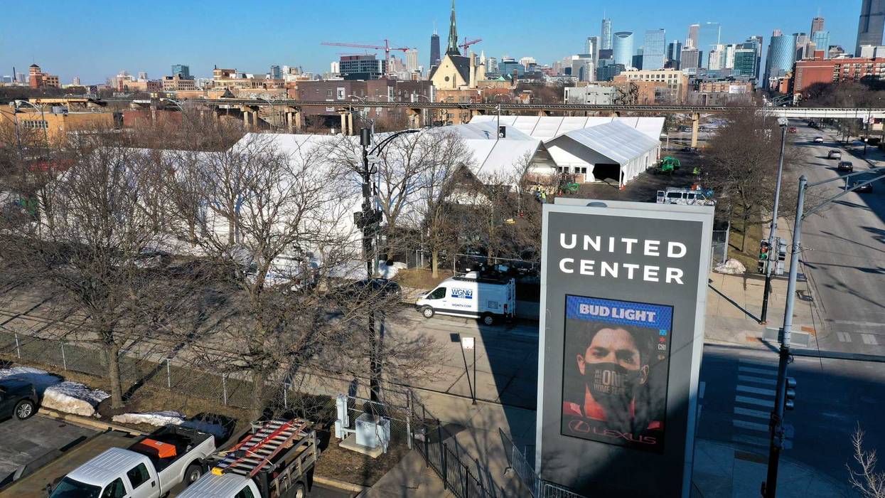 An aerial photo shot with a drone shows a COVID-19 vaccination center being constructed in a parking lot at the United Center, home to the NBA Chicago Bulls and NHL Blackhawks, on March 02, 2021 in Chicago, Illinois. The site is projected to distribute 6,000 vaccines-per-day once it begins operation next week.