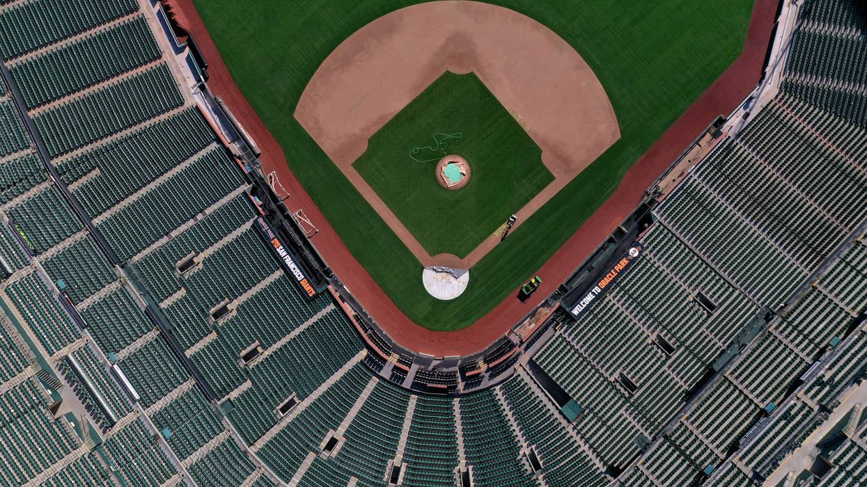An aerial view from a drone shows Oracle Park, home of the San Francisco Giants, empty on Opening Day March 26, 2020 in San Francisco, California.