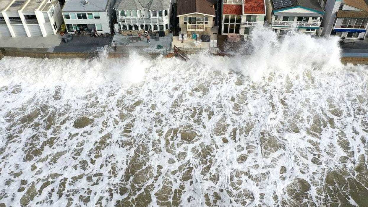An aerial view of Pacific Ocean waves crashing against a seawall protecting homes on December 30, 2023 near Ventura, California. Dangerous surf churned up by storms in the Pacific is impacting much of California’s coastline with coastal flooding possible in some low-lying areas. A 2023 study from UC San Diego Scripps Institution of Oceanography showed that California’s winter waves have increased in size since 1970 as climate change has warmed the planet. (Photo by Mario Tama/Getty Images)