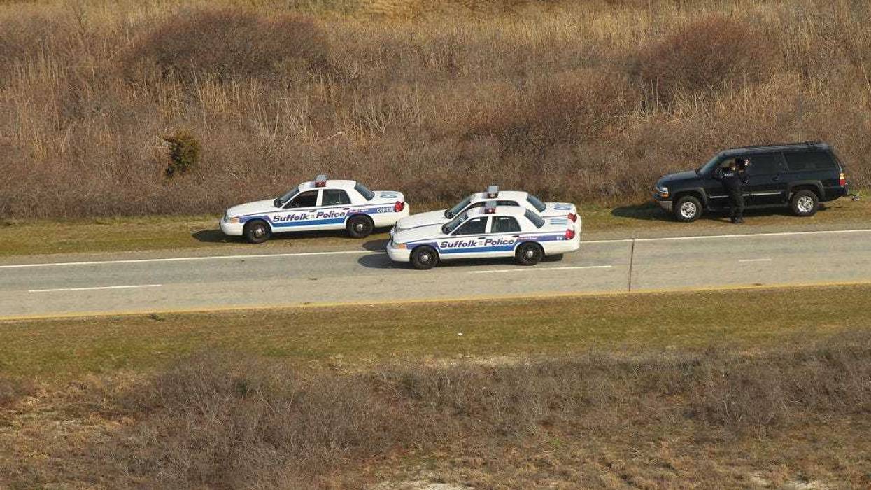 An aerial view of police cars near where a body was discovered in the area near Gilgo Beach and Ocean Parkway on Long Island on April 15, 2011 in Wantagh, New York.
