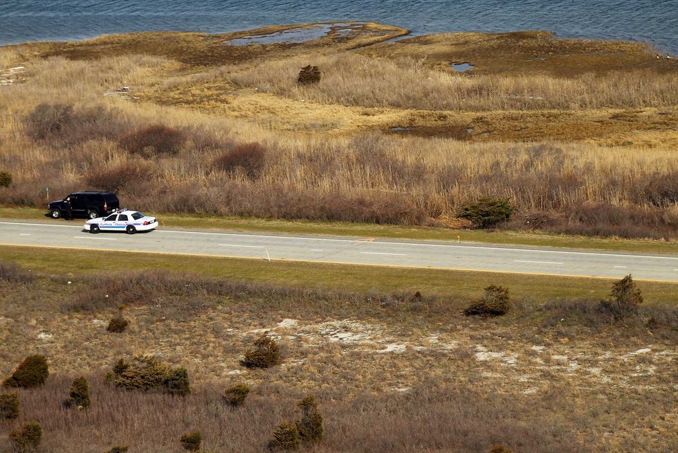 An aerial view of police cars near where a body was discovered near Gilgo Beach and Ocean Parkway in Wantagh on April 15, 2011
