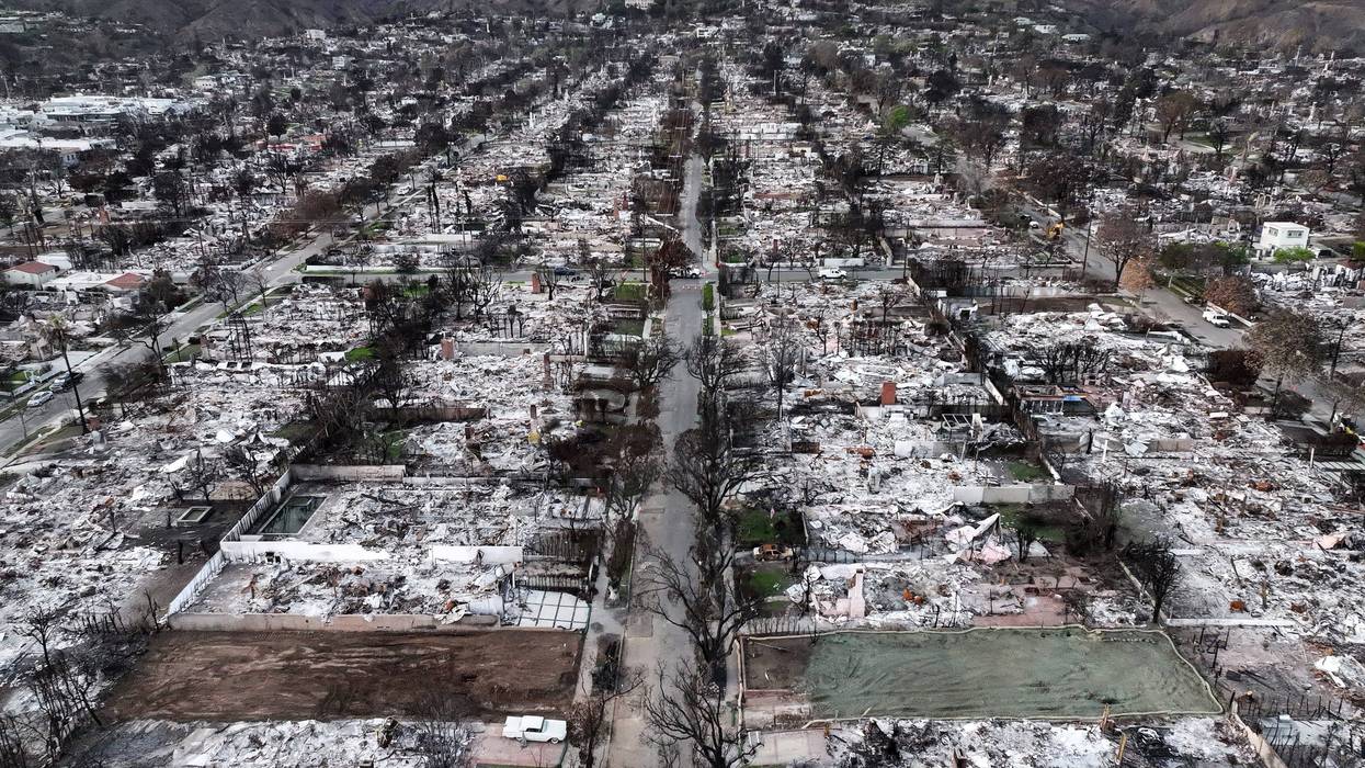 An aerial view of two properties cleared of debris amid the ruins of homes destroyed in the Palisades Fire, on February 27, 2025 in Pacific Palisades, California.