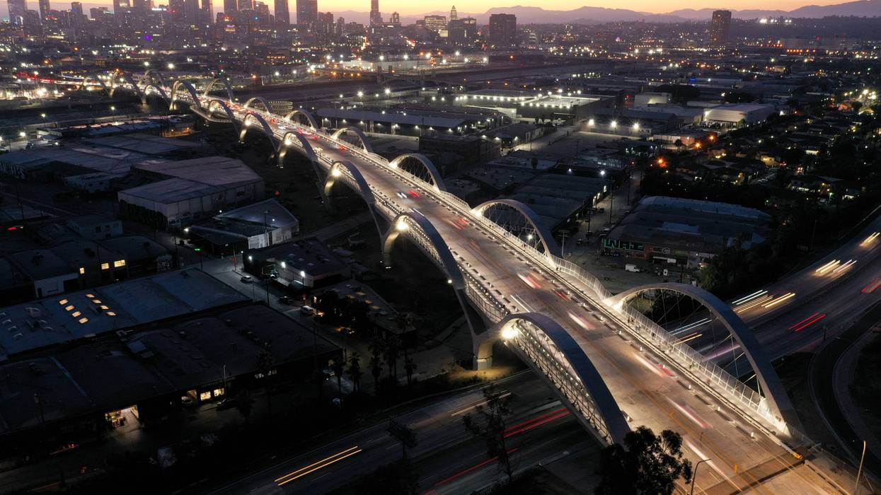 An aerial view of vehicles passing over the newly-opened 6th Street Viaduct, connecting Boyle Heights with downtown L.A., on July 11, 2022 in Los Angeles, California.
