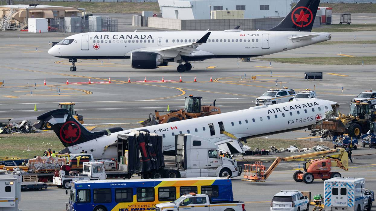 Mangled plane in LaGuardia crash is towed from runway as most injured passengers leave hospital