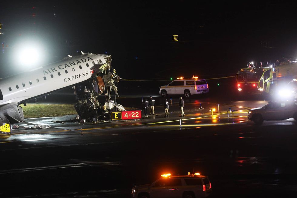 An Air Canada Express plane sits on the tarmac after it collided with a fire truck on the tarmac at LaGuardia Airport on March 23, 2026