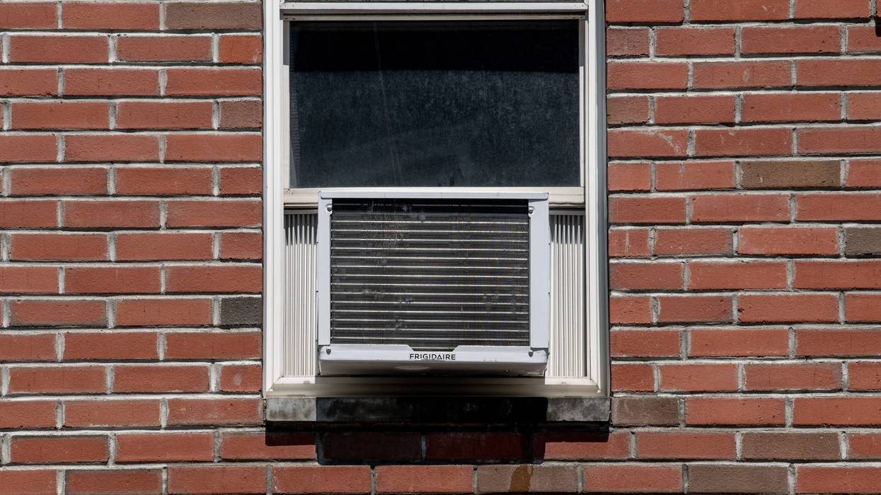 An air conditioner is seen in a residential window on July 28, 2020, in New York City.