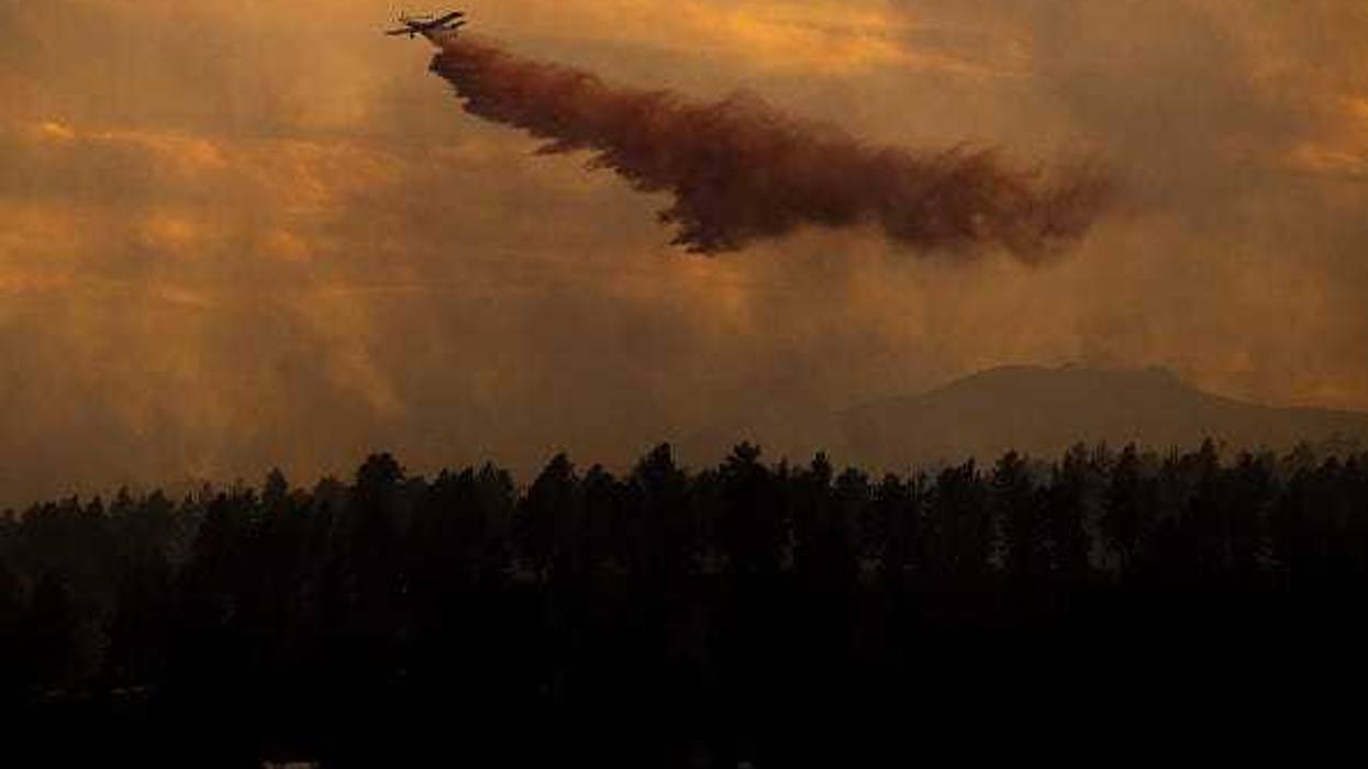 An air tanker drops slurry on the NCAR Fire on March 26, 2022 in Boulder, Colorado. The wildfire, which has forced almost 20,000 people to evacuate their homes, started just a few miles away from where the Marshall Fire destroyed more than 1,000 homes in December.