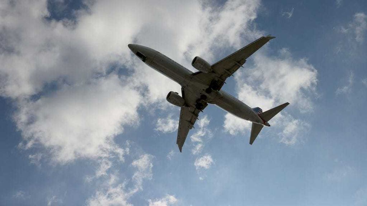 An American Airlines Boeing 787-9 Dreamliner approaches for a landing at the Miami International Airport on December 10, 2021 in Miami, Florida.