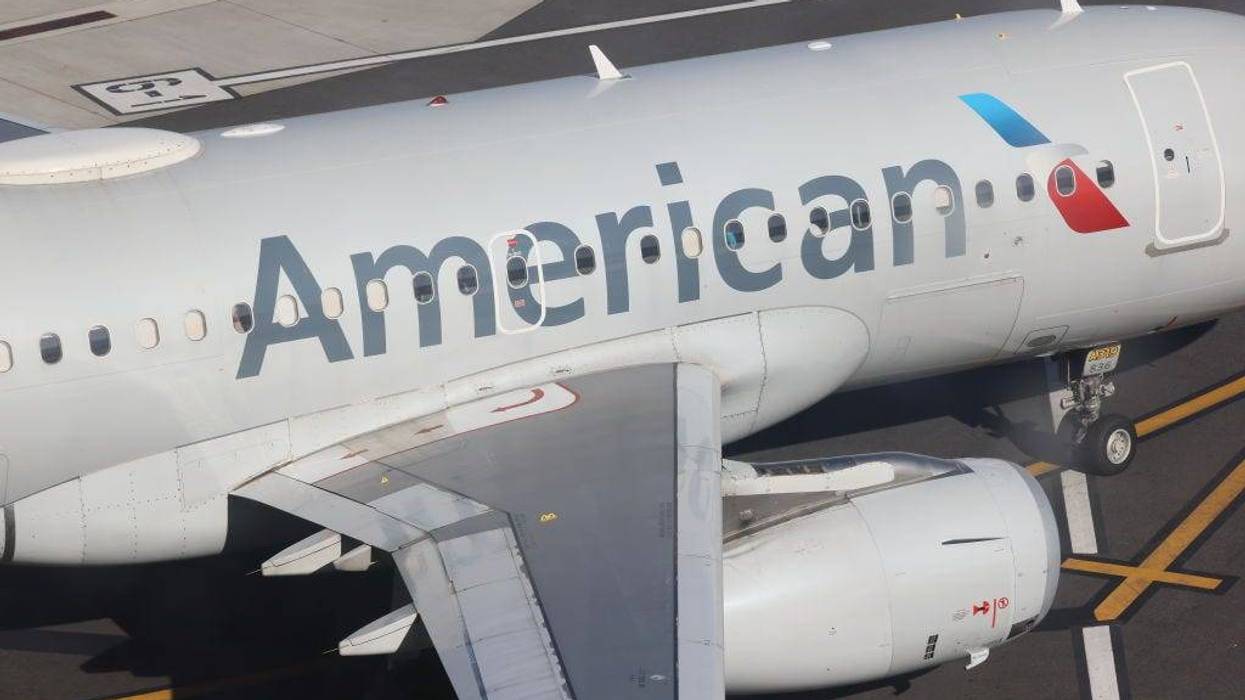 An American Airlines jet moves along the runway at Laguardia AIrport